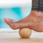 Cork acupressure ball used with foot